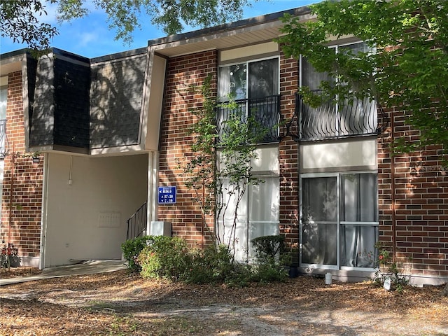1700 SW 16th Ct Unit D30, Gainesville, FL 32608 - rear view of house with brick siding