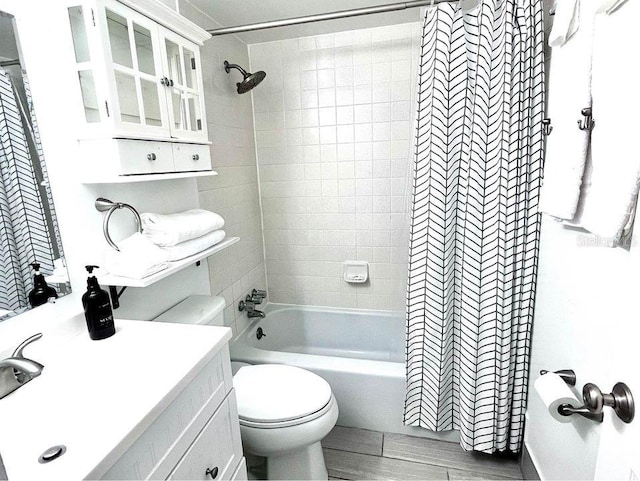 1700 SW 16th Ct Unit D30, Gainesville, FL 32608 - full bathroom featuring shower / bathtub combination with curtain, toilet, vanity, and wood finished floors