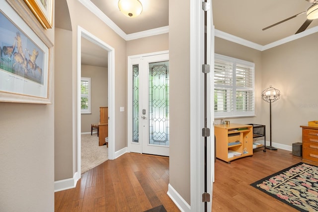 2638 SW 118th Ter, Gainesville, FL 32608 - entryway with ceiling fan, hardwood / wood-style floors, crown molding, and baseboards