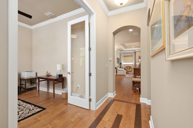 2638 SW 118th Ter, Gainesville, FL 32608 - corridor featuring arched walkways, hardwood / wood-style floors, ornamental molding, baseboards, and a raised ceiling