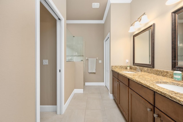 2638 SW 118th Ter, Gainesville, FL 32608 - bathroom with double vanity, tile patterned floors, a shower with door, ornamental molding, and baseboards