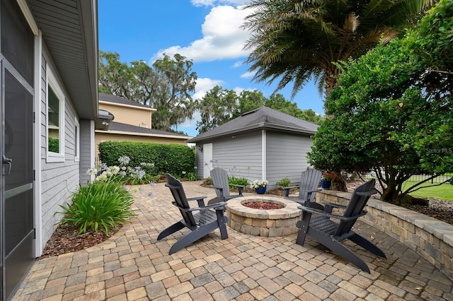 2638 SW 118th Ter, Gainesville, FL 32608 - view of patio / terrace with an outdoor fire pit