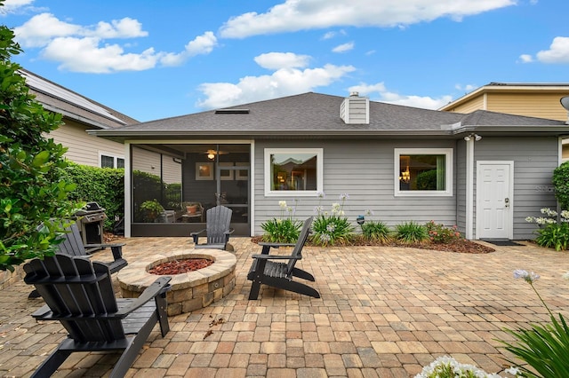 2638 SW 118th Ter, Gainesville, FL 32608 - view of patio featuring an outdoor fire pit and a sunroom