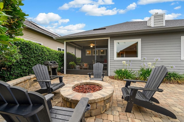 2638 SW 118th Ter, Gainesville, FL 32608 - view of patio / terrace with an outdoor fire pit, a sunroom, and a grill
