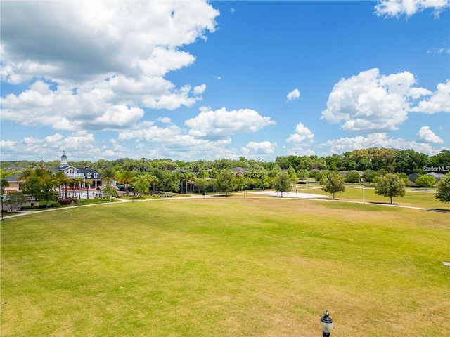 2638 SW 118th Ter, Gainesville, FL 32608 - surrounding community featuring a lawn and view of wooded area