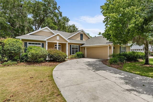 8360 SW 74th Pl, Gainesville, FL 32608 - view of front of home with a garage, a front yard, driveway, and a shingled roof