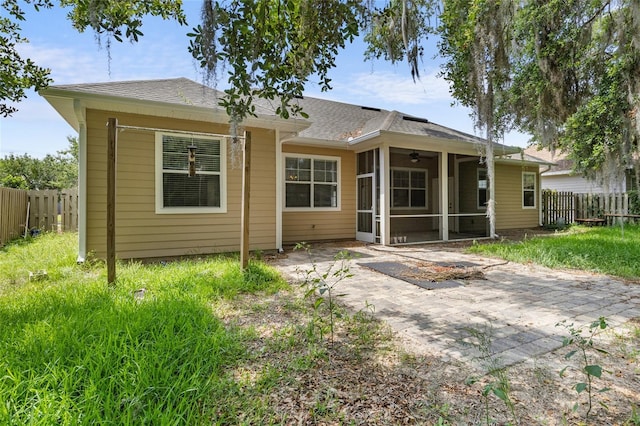 8360 SW 74th Pl, Gainesville, FL 32608 - rear view of house with a sunroom, a patio area, a ceiling fan, and roof with shingles