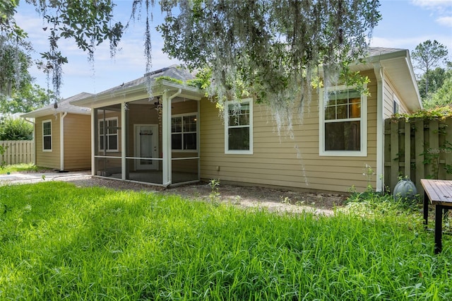 8360 SW 74th Pl, Gainesville, FL 32608 - rear view of property with a sunroom and ceiling fan
