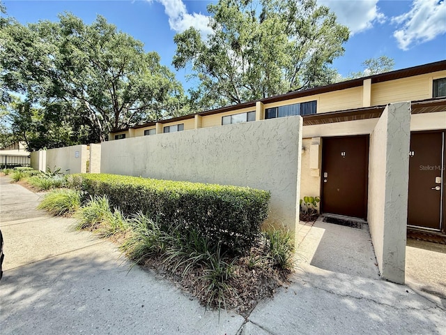 2058 SW 35th Pl Unit H47, Gainesville, FL 32608 - property entrance featuring stucco siding