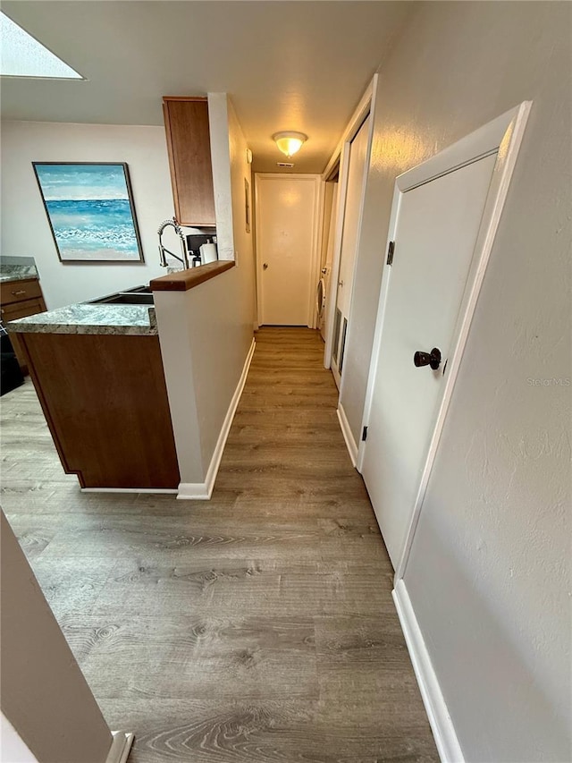 2058 SW 35th Pl Unit H47, Gainesville, FL 32608 - hall with wood finished floors and baseboards