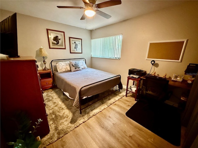 2058 SW 35th Pl Unit H47, Gainesville, FL 32608 - bedroom featuring wood finished floors and a ceiling fan