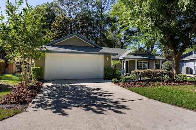 8103 SW 71st Ln, Gainesville, FL 32608 - ranch-style home with driveway, a garage, a shingled roof, and central air condition unit