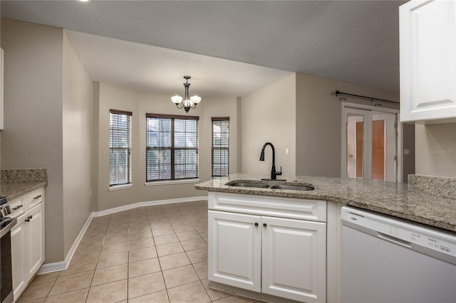 8103 SW 71st Ln, Gainesville, FL 32608 - kitchen with white dishwasher, a sink, a chandelier, white cabinets, and light tile patterned flooring