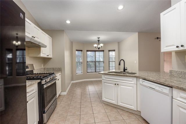 8103 SW 71st Ln, Gainesville, FL 32608 - kitchen with white dishwasher, stainless steel gas stove, a sink, under cabinet range hood, and black fridge