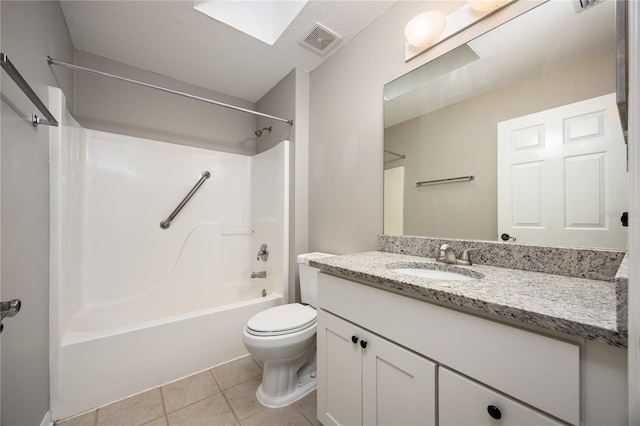 8103 SW 71st Ln, Gainesville, FL 32608 - full bath featuring vanity, toilet, tile patterned floors, and washtub / shower combination