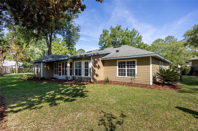 8103 SW 71st Ln, Gainesville, FL 32608 - view of front of house featuring a front yard and a shingled roof