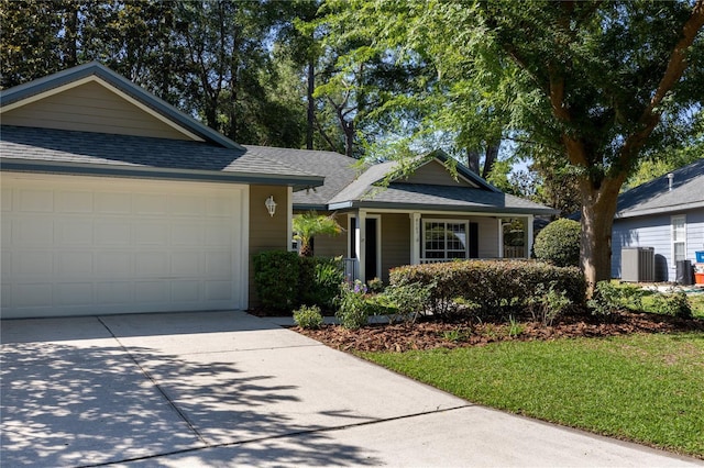 8103 SW 71st Ln, Gainesville, FL 32608 - single story home with roof with shingles, central AC, driveway, and covered porch