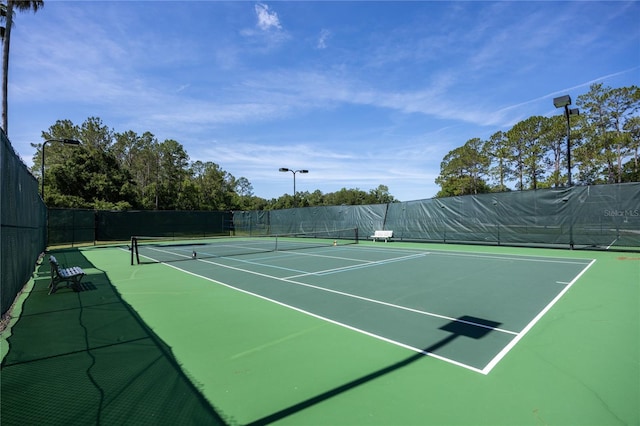 8103 SW 71st Ln, Gainesville, FL 32608 - view of tennis court with community basketball court