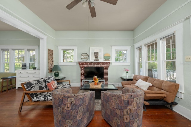 119 NW 7th Ter, Gainesville, FL 32601 - living room featuring hardwood / wood-style floors, ceiling fan, healthy amount of natural light, and a brick fireplace