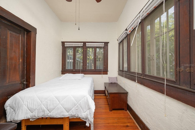 119 NW 7th Ter, Gainesville, FL 32601 - bedroom featuring wood finished floors and baseboards