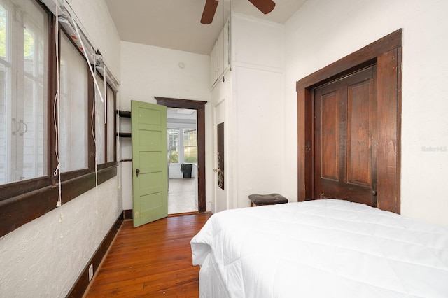 119 NW 7th Ter, Gainesville, FL 32601 - bedroom featuring dark wood-style flooring and ceiling fan