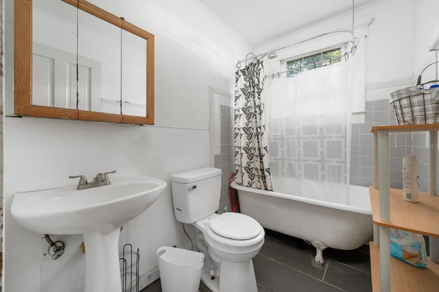 119 NW 7th Ter, Gainesville, FL 32601 - bathroom with tile walls, toilet, shower / tub combo with curtain, and tile patterned flooring
