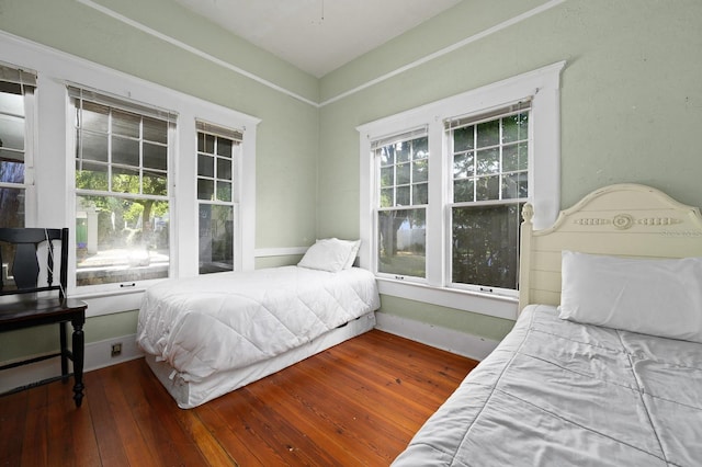 119 NW 7th Ter, Gainesville, FL 32601 - bedroom featuring hardwood / wood-style floors and baseboards