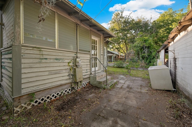 119 NW 7th Ter, Gainesville, FL 32601 - view of home's exterior with entry steps and a patio area