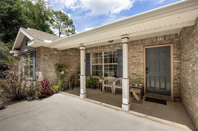 1841 SE 245th St, Hawthorne, FL 32640 - entrance to property with a porch, brick siding, and roof with shingles