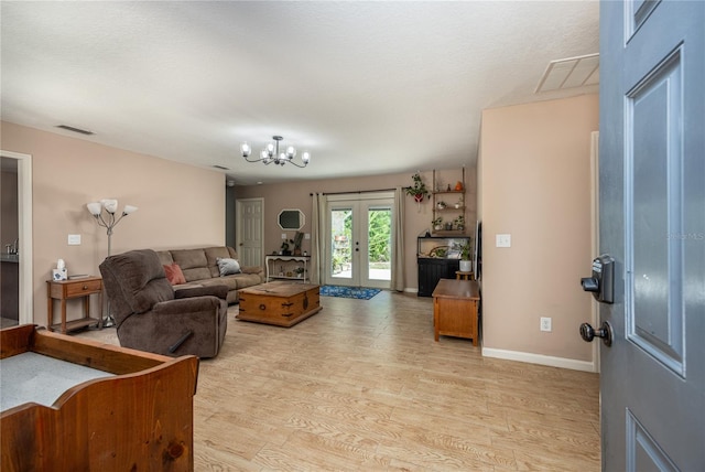 1841 SE 245th St, Hawthorne, FL 32640 - living area with light wood-style floors, a chandelier, french doors, and baseboards