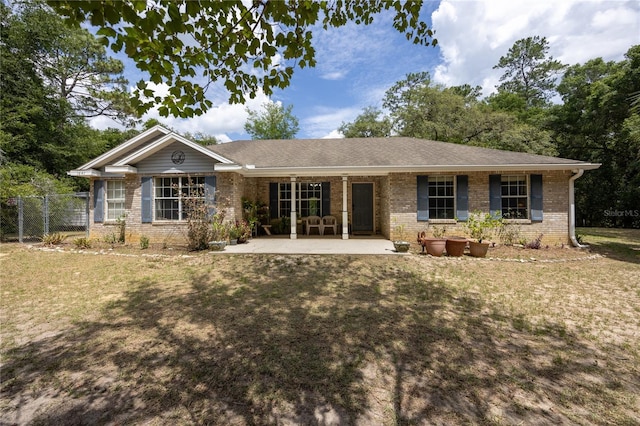 1841 SE 245th St, Hawthorne, FL 32640 - single story home featuring brick siding and a patio