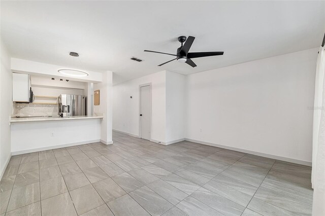 2735 SW 35th Pl Unit 1905, Gainesville, FL 32608 - unfurnished living room with a ceiling fan and light tile patterned floors