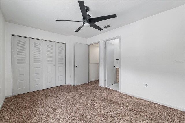 2735 SW 35th Pl Unit 1905, Gainesville, FL 32608 - unfurnished bedroom featuring carpet floors, a closet, ceiling fan, and connected bathroom
