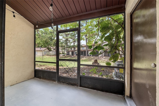 2735 SW 35th Pl Unit 1905, Gainesville, FL 32608 - unfurnished sunroom featuring a residential view