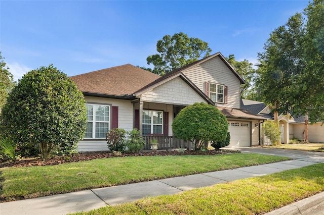 8877 SW 80th Ave, Gainesville, FL 32608 - view of front facade with driveway, a front yard, and roof with shingles