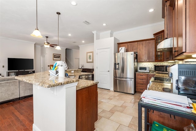 8877 SW 80th Ave, Gainesville, FL 32608 - kitchen featuring appliances with stainless steel finishes, crown molding, open floor plan, ceiling fan, and light stone countertops