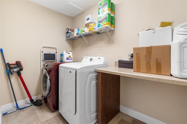 8877 SW 80th Ave, Gainesville, FL 32608 - washroom featuring separate washer and dryer, baseboards, and attic access
