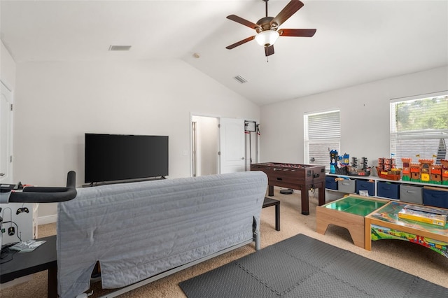 8877 SW 80th Ave, Gainesville, FL 32608 - bedroom with light colored carpet, vaulted ceiling, and a ceiling fan