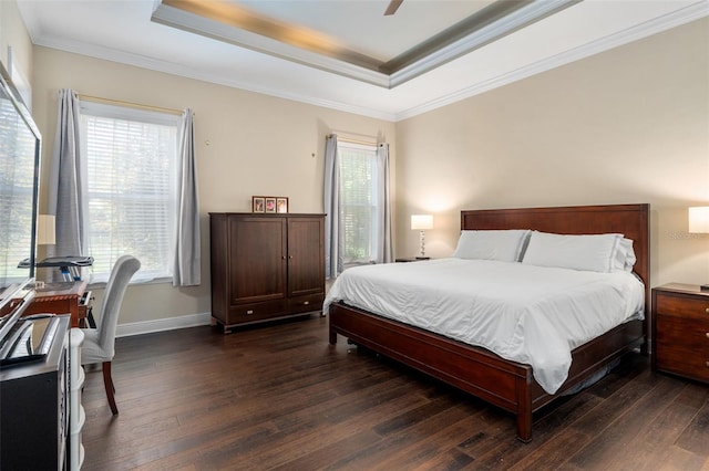 8877 SW 80th Ave, Gainesville, FL 32608 - bedroom with a raised ceiling, dark wood-style floors, ornamental molding, baseboards, and ceiling fan
