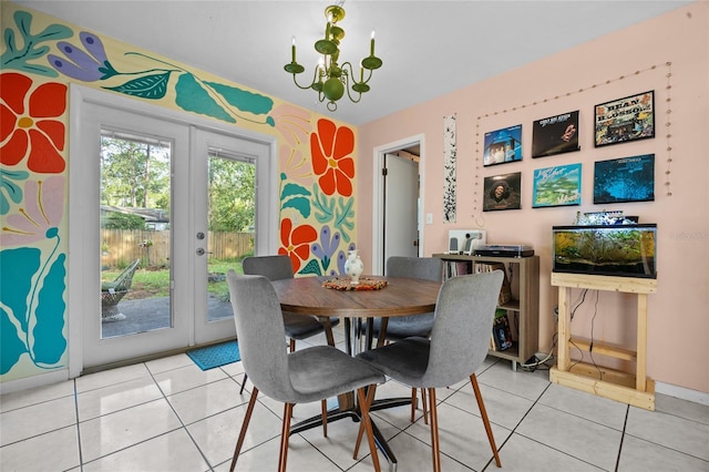 4510 NW 27th Ter, Gainesville, FL 32605 - dining space with french doors, light tile patterned flooring, and baseboards