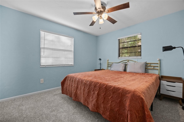 4510 NW 27th Ter, Gainesville, FL 32605 - bedroom with carpet flooring, baseboards, and a ceiling fan