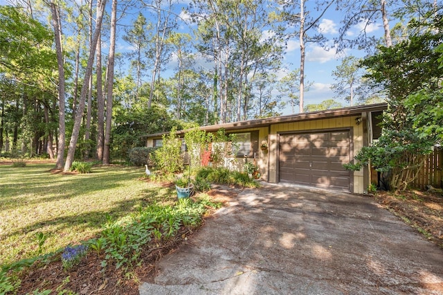 4510 NW 27th Ter, Gainesville, FL 32605 - view of front facade featuring asphalt driveway and a garage