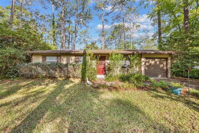 4510 NW 27th Ter, Gainesville, FL 32605 - ranch-style home with an attached garage, a front lawn, and driveway