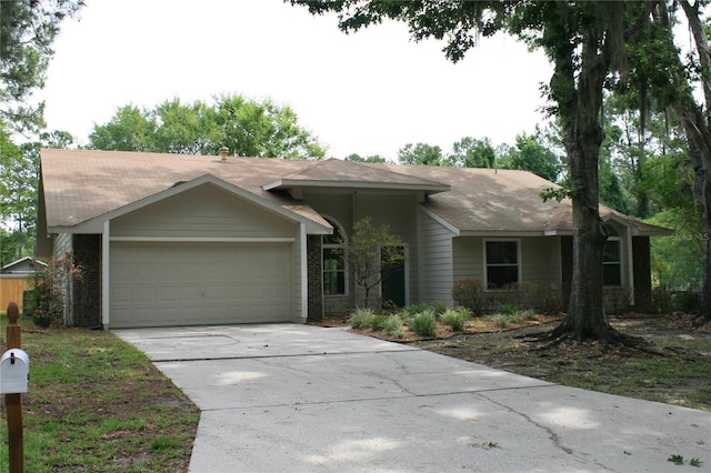 7518 NW 35th Pl, Gainesville, FL 32606 - ranch-style home featuring a garage and concrete driveway