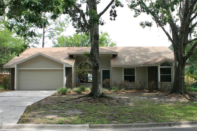 7518 NW 35th Pl, Gainesville, FL 32606 - single story home featuring an attached garage, driveway, and brick siding