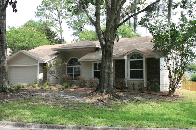 7518 NW 35th Pl, Gainesville, FL 32606 - ranch-style house featuring a garage and a front lawn
