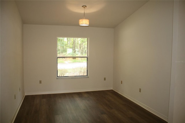 7518 NW 35th Pl, Gainesville, FL 32606 - empty room featuring dark wood-type flooring and baseboards