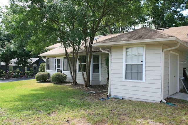 7518 NW 35th Pl, Gainesville, FL 32606 - view of front of property with a front lawn and a shingled roof