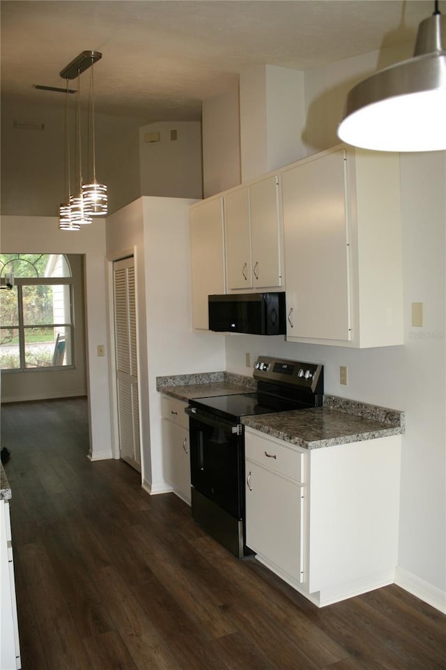 7518 NW 35th Pl, Gainesville, FL 32606 - kitchen featuring electric range, black microwave, high vaulted ceiling, dark wood-type flooring, and white cabinets