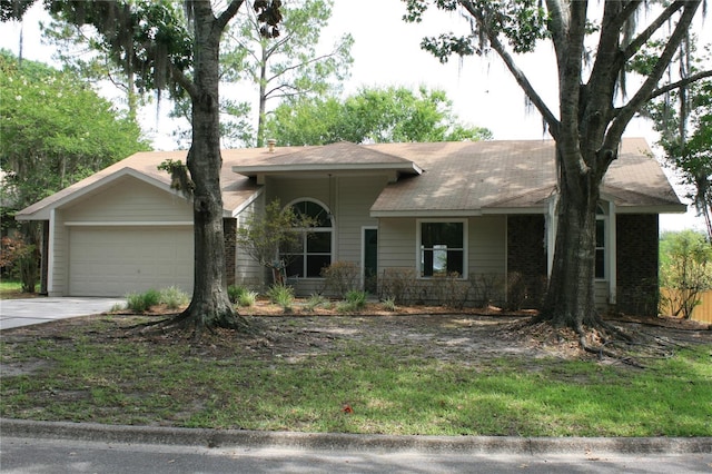7518 NW 35th Pl, Gainesville, FL 32606 - ranch-style home featuring a garage and concrete driveway